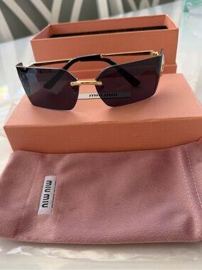 Miu Miu Women Black Lens Rimless Sunglasses with Gold Accents